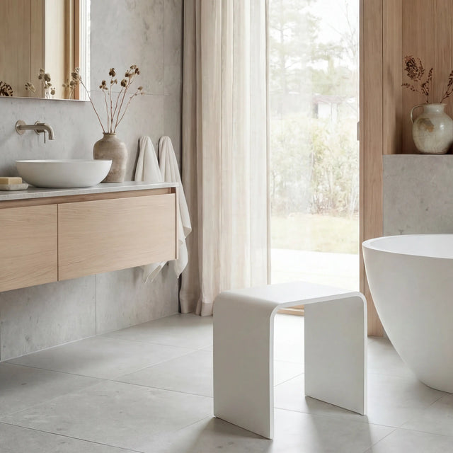 Modern bathroom with wooden vanity, freestanding bathtub, and large window.