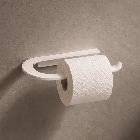 Wall-mounted toilet paper holder with a roll of toilet paper on a bathroom wall.