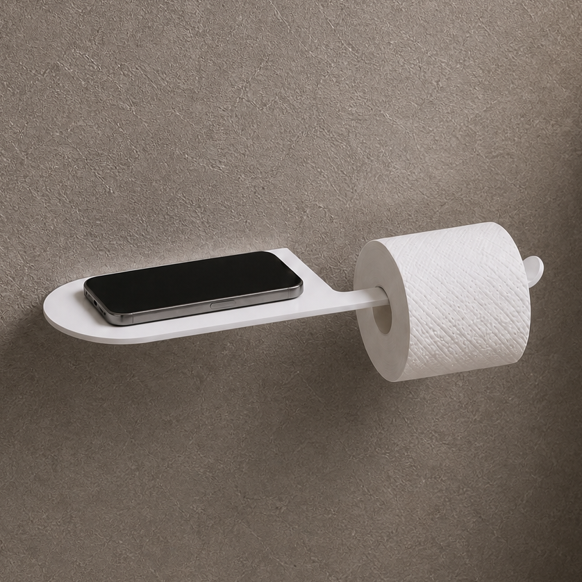 Wall-mounted toilet paper holder with smartphone tray in a bathroom setting.