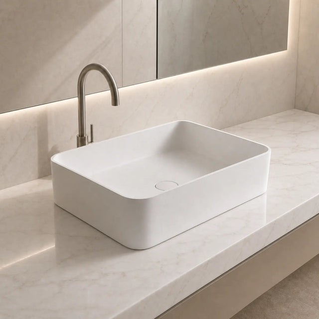 Modern bathroom sink with faucet on a light-colored countertop