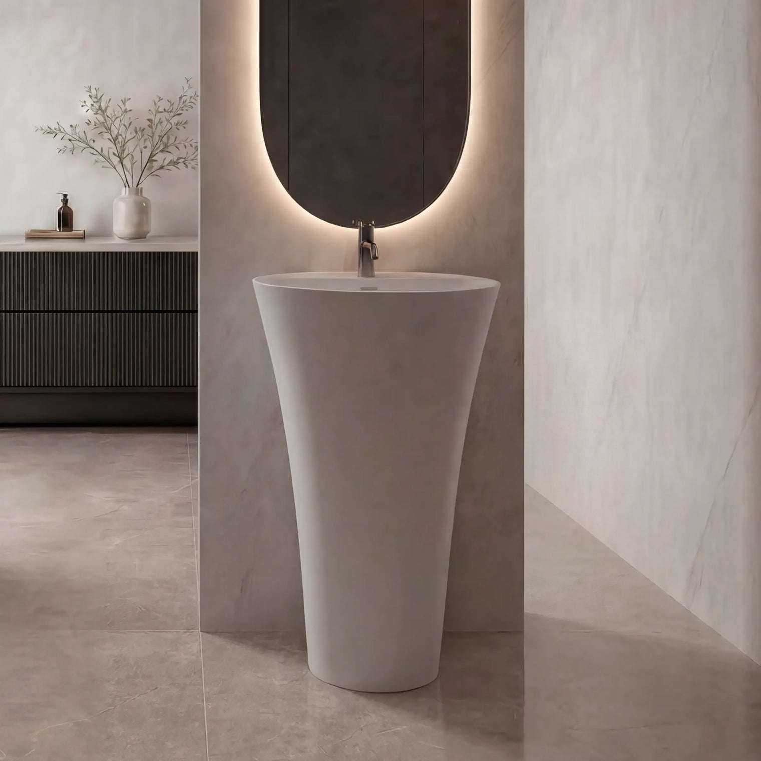 Modern bathroom with freestanding bathtub, sink, and mirror with built-in lighting.