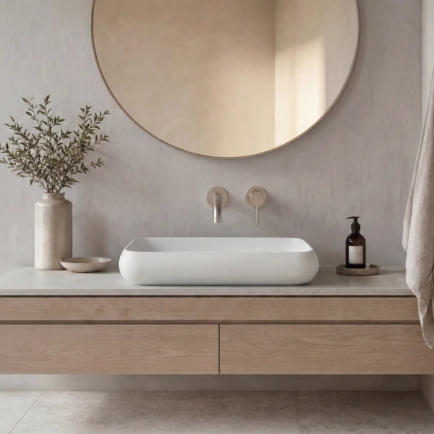 Modern bathroom vanity with a round mirror, sink, and decorative elements.