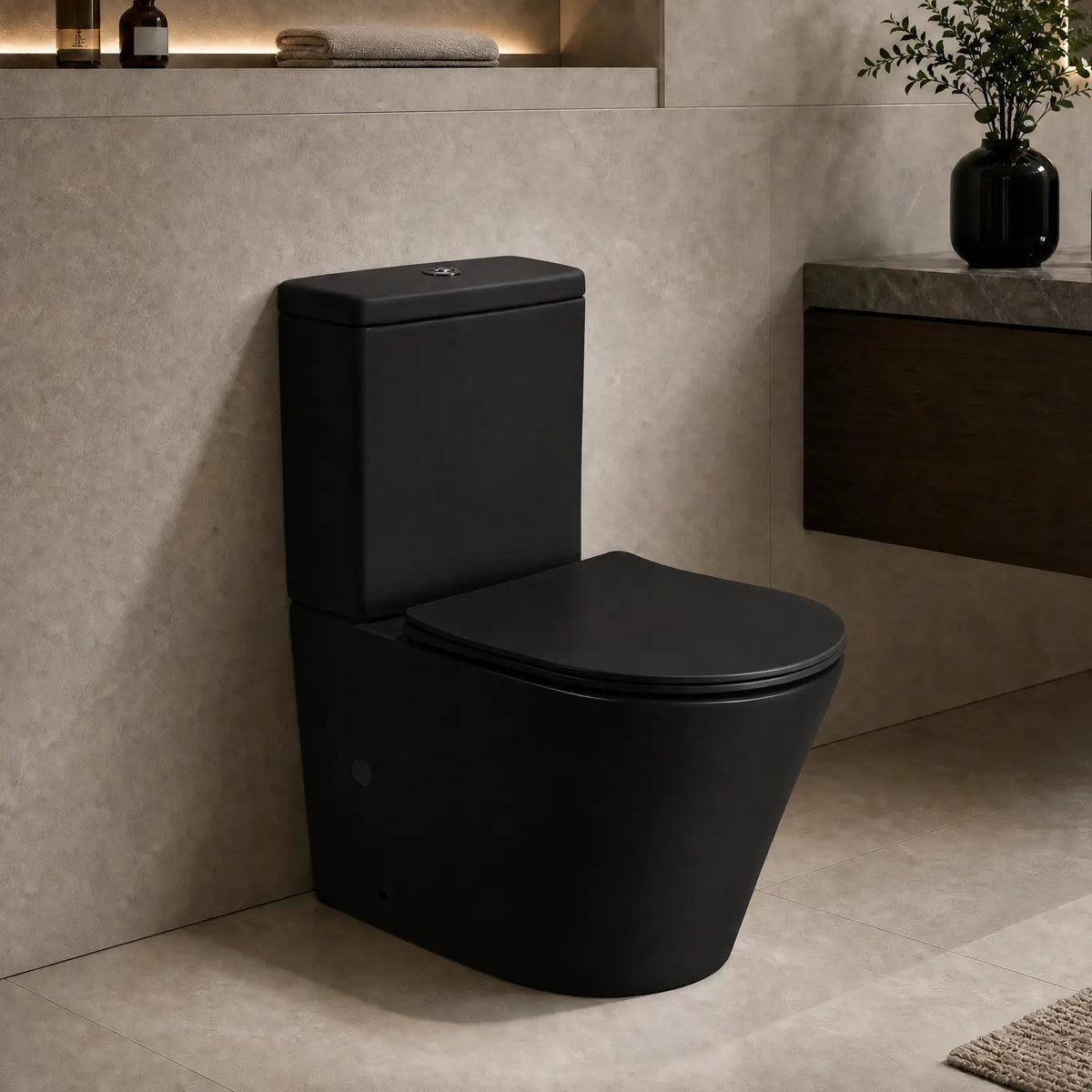 A matte black 2-piece toilet with a matching closed lid, shown installed in a modern bathroom with beige stone walls and a floating dark wood vanity.