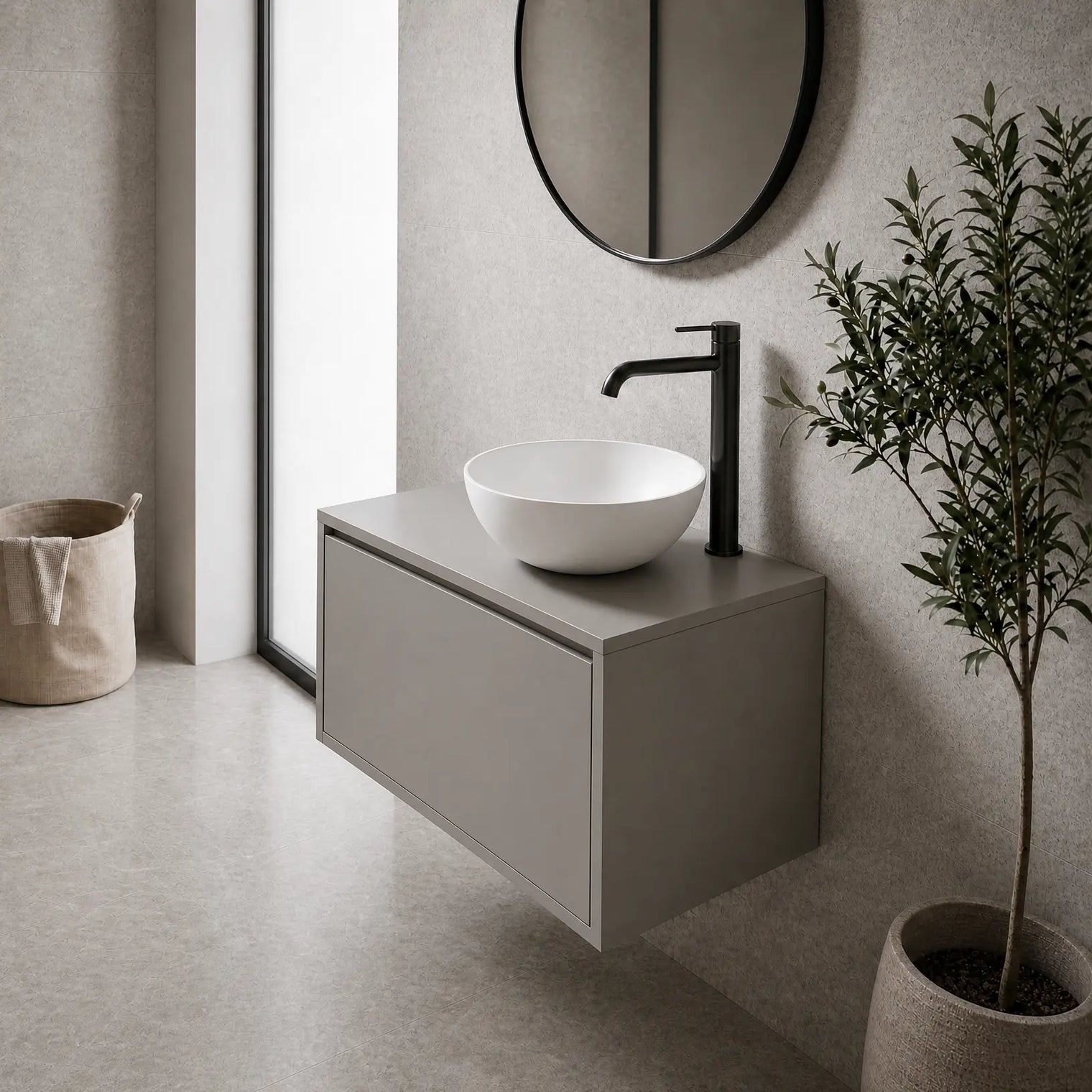 Modern bathroom with a floating vanity, round mirror, and plant.