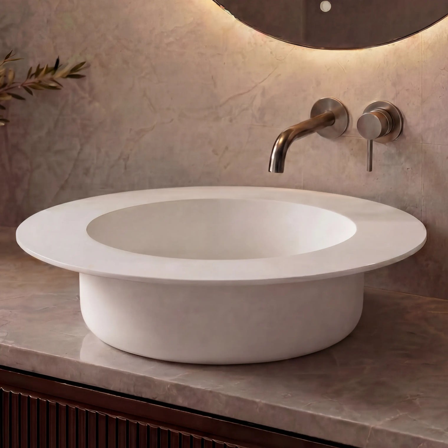 Modern bathroom sink with faucet against a neutral wall