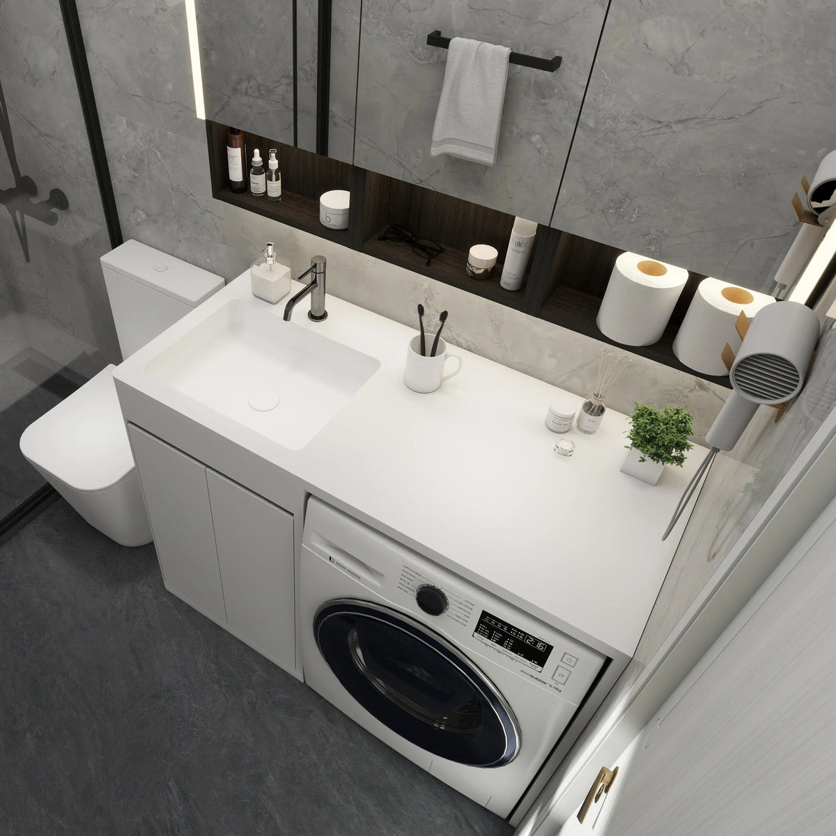 Modern bathroom with washing machine, sink, and various toiletries.