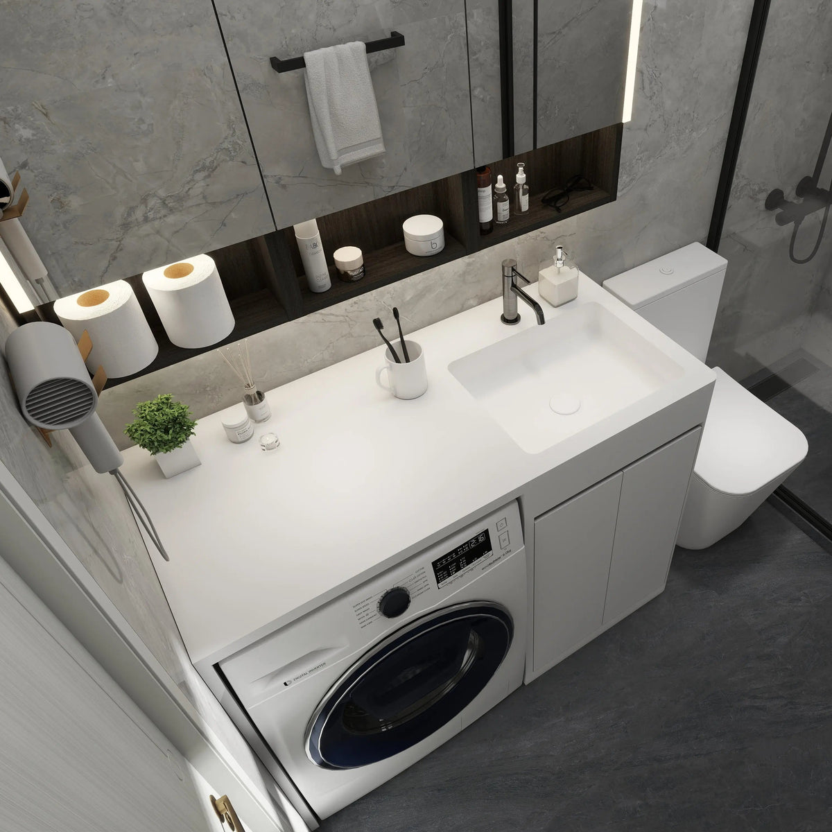 Modern bathroom with washing machine, sink, and various toiletries.