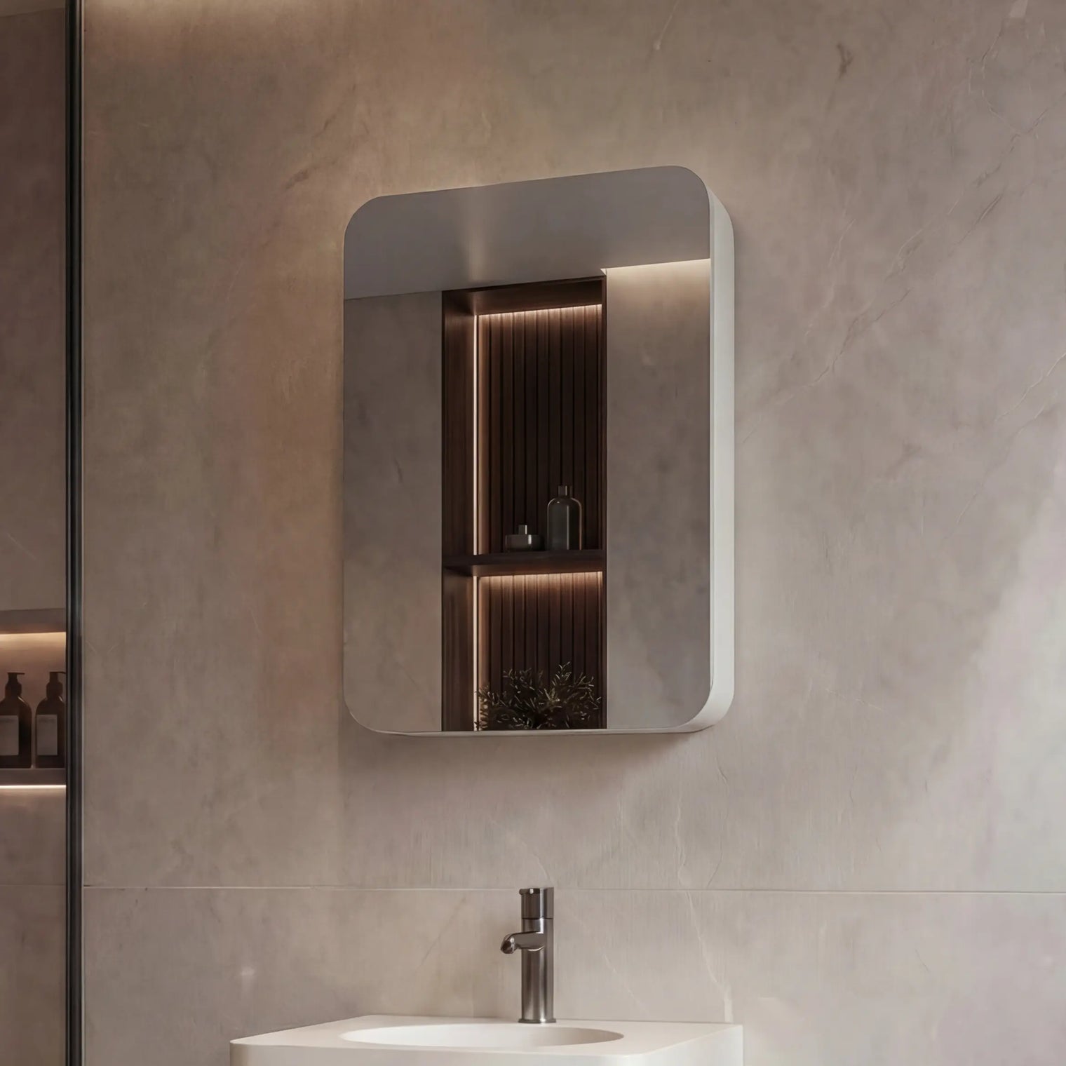 Modern bathroom with a sink, mirror, and shower area.