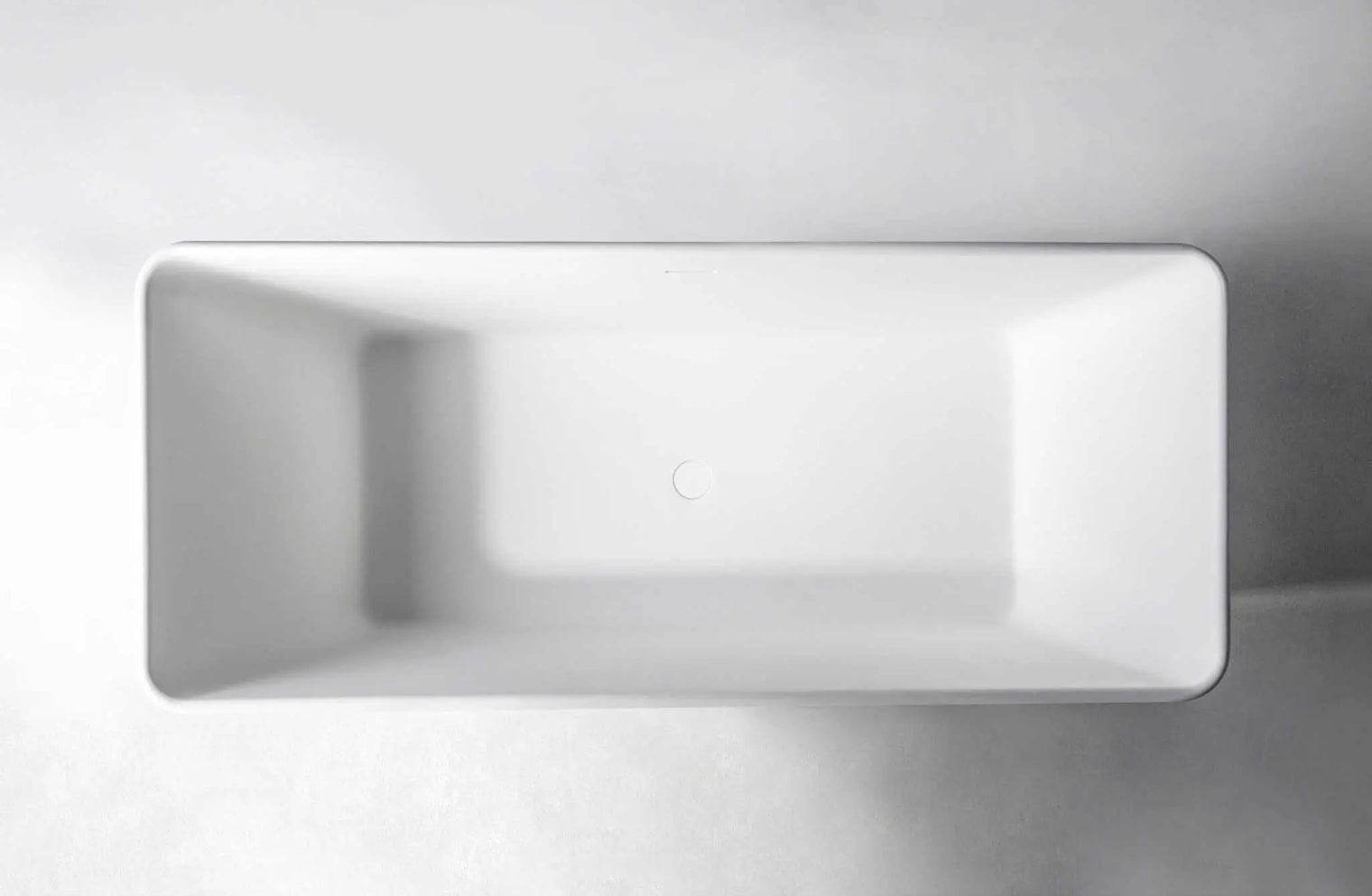 Top view of a white rectangular Ragusa 165 freestanding bathtubs made of solid surfaces