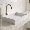 Modern bathroom with marble vanity and solid surfaces basin
