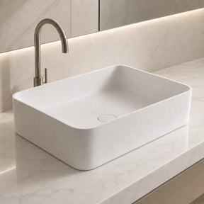 Modern bathroom sink with faucet on a light-colored countertop