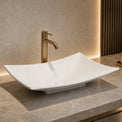 Modern bathroom solid surfaces sink with faucet on a marble countertop