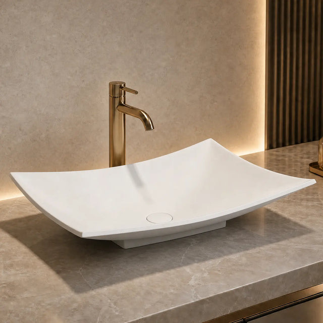 Modern bathroom solid surfaces sink with faucet on a marble countertop