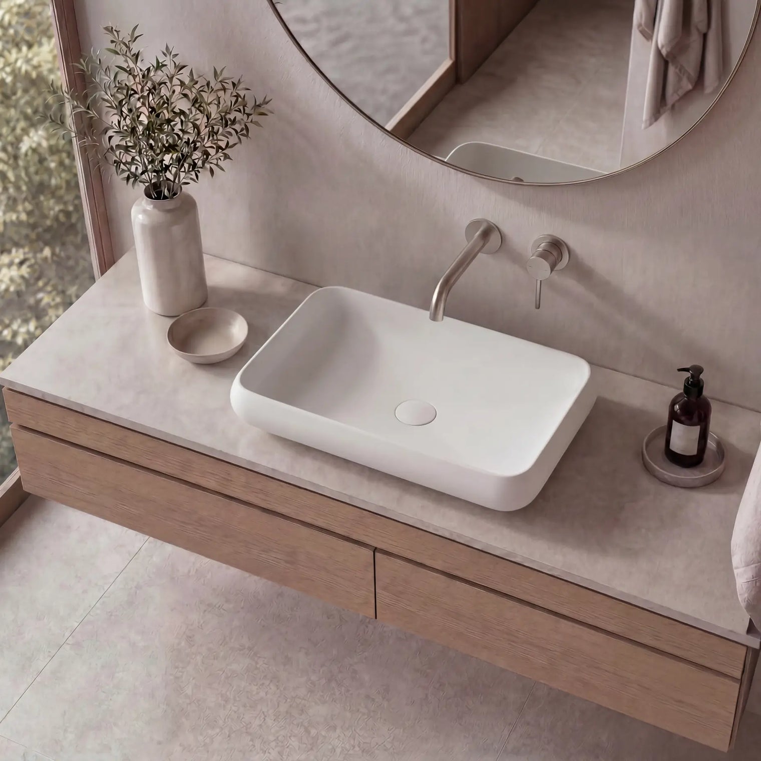 Bathroom vanity with a white sink, wooden cabinet, and decorative elements.