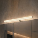 Modern wall-mounted light fixture on a textured wall