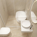 A modern bathroom interior with a white wall-mounted toilet, a white vessel sink on a floating shelf, a round backlit mirror, and a glass shower enclosure with beige stone tile walls and floor.