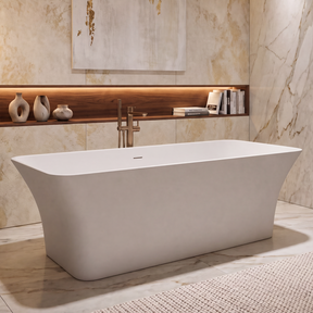 A modern freestanding bathtub in a luxurious marble bathroom with warm lighting, a bronze floor lamp, and a built-in wood shelf with decorative vases.