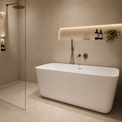A modern freestanding bathtub in a minimalist beige-toned bathroom, with a glass shower enclosure, built-in shelving, and warm ambient lighting.