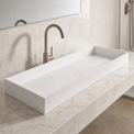 Modern bathroom sink with faucet in a marble-like setting