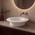 Modern bathroom sink with faucet against a neutral wall