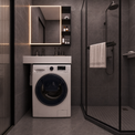 A white front-load washing machine with a dark blue circular door is installed beneath a white sink and illuminated rectangular mirror in a modern dark gray bathroom. To the right is a glass shower enclosure with a hanging towel.