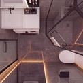 Modern bathroom interior with gray stone-look tiles, warm LED strip lighting, a white toilet, a white vanity unit, and a glass shower screen with black framing.