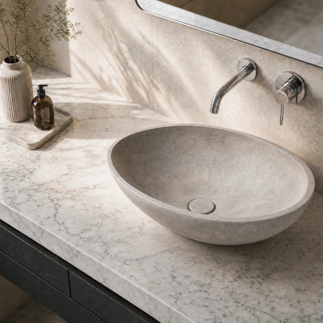 Bathroom vanity with a stone concrete sink and faucet