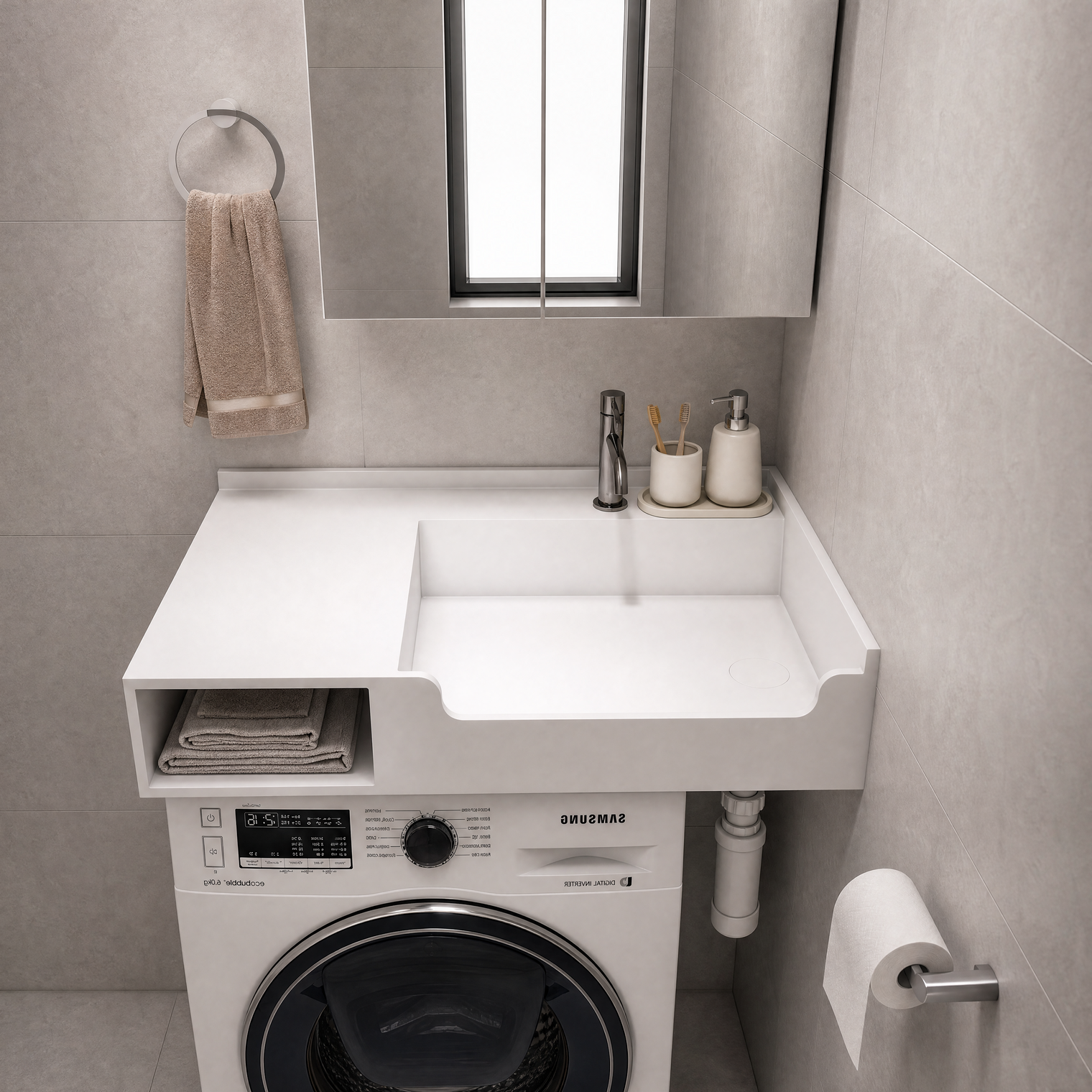 A white wall-mounted laundry sink and washer combo unit in a modern gray tiled bathroom. The white countertop features a rectangular sink basin, a side storage shelf with folded towels, a chrome faucet, and a built-in Samsung washing machine underneath.