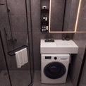 A modern bathroom scene featuring a white wall-mounted sink and washing machine combo, a black-framed glass shower enclosure, dark gray stone-look tiles, and a lit mirror.