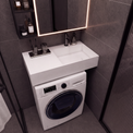 A modern bathroom vanity setup with a white integrated sink and washing machine cabinet, set against dark gray tiled walls under a lit mirror.