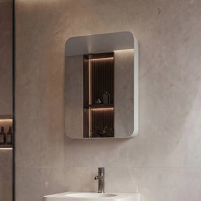 Modern bathroom with a sink, mirror, and shower area.